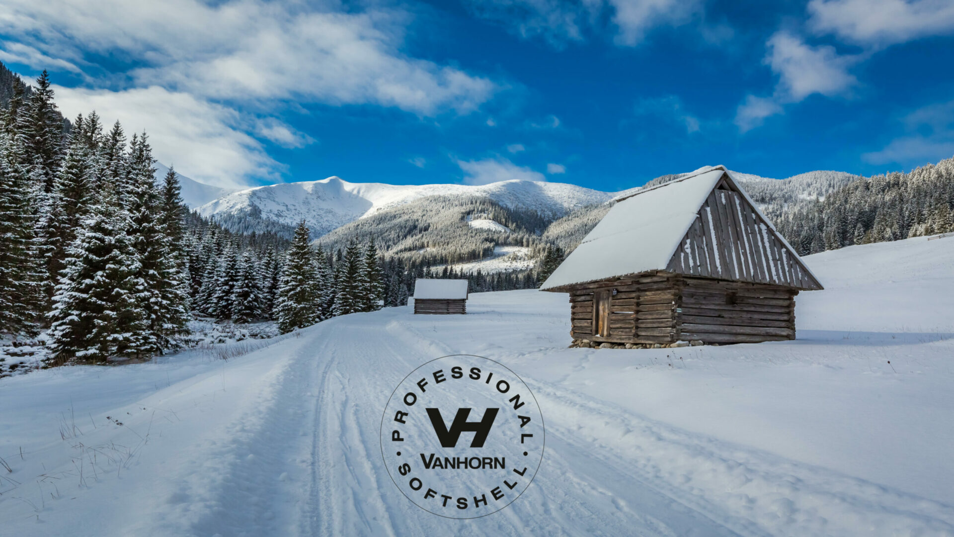 Wooden cottages and snowy road in winter, Tatra Mountains